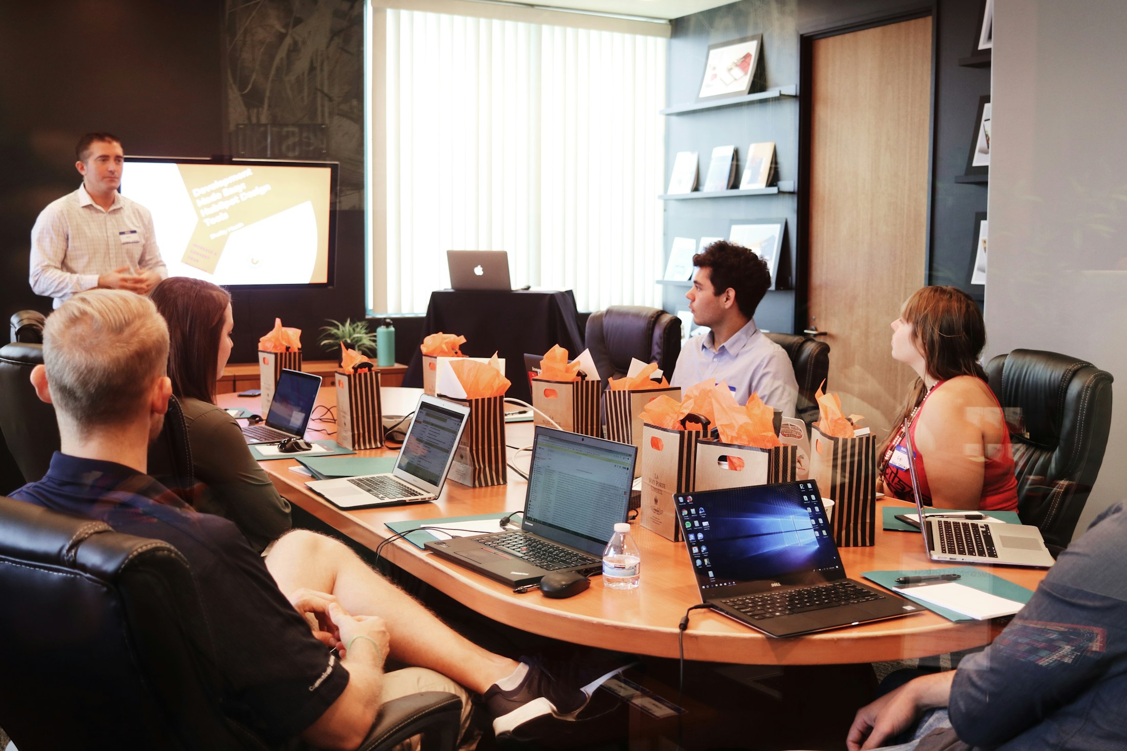 Executive presenting AI strategy outcomes in a boardroom